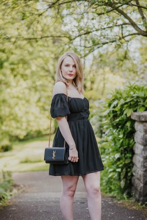 Stylish girl look with a black dress, rotang purse and sun glasses Stock  Photo by yanaiskayeva